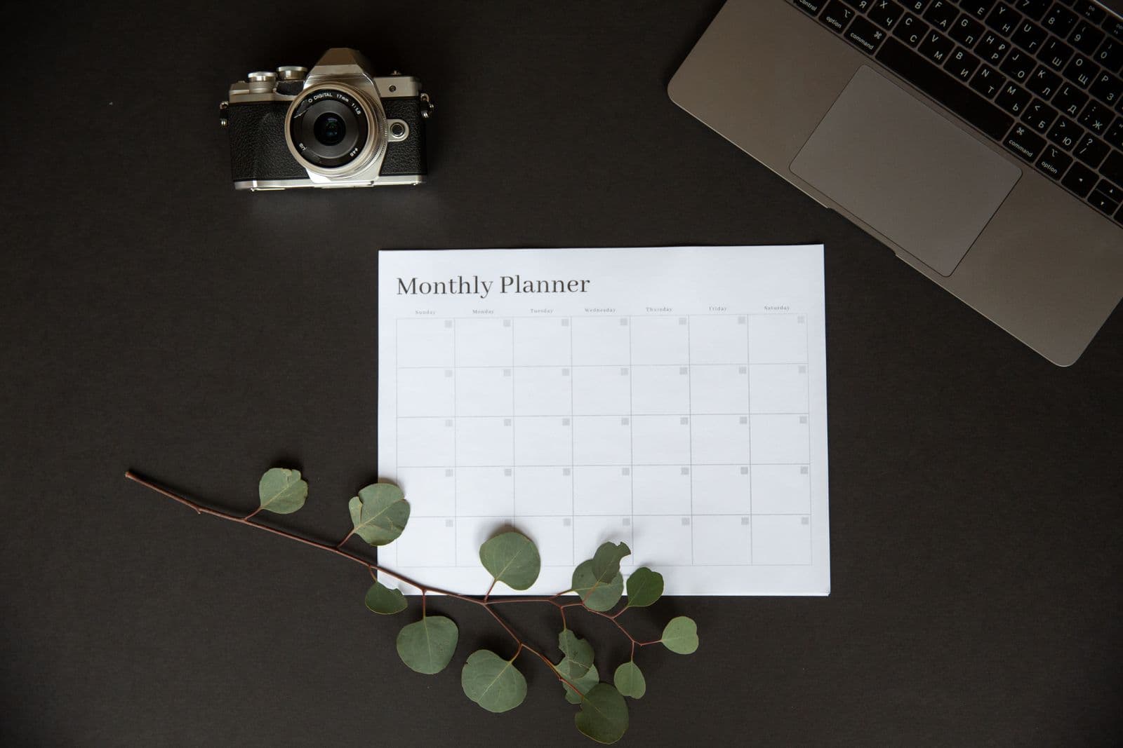 A weekly calendar view open on a laptop screen with meetings blocked out across several days