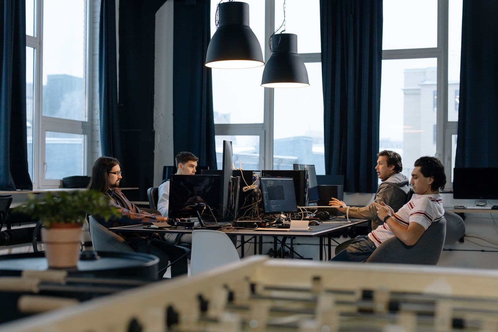 A modern office workspace representing a mixed team of people and automated systems