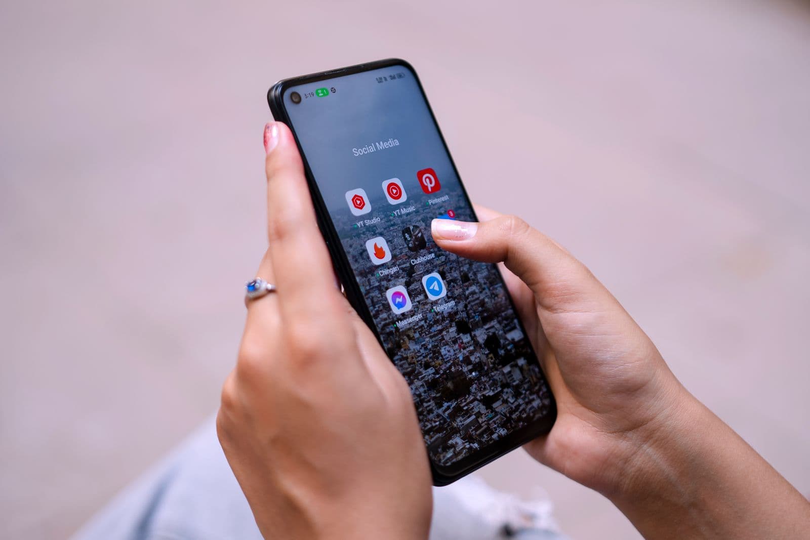 A content calendar and social media posts laid out on a screen with a phone beside it